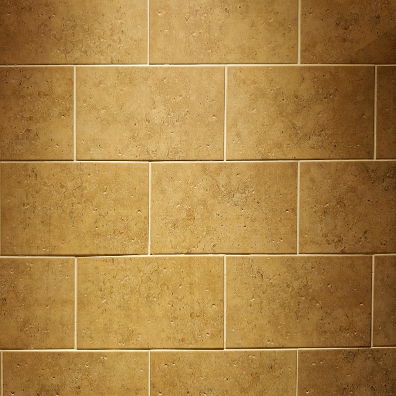 Warm travertine tile with light grout lines