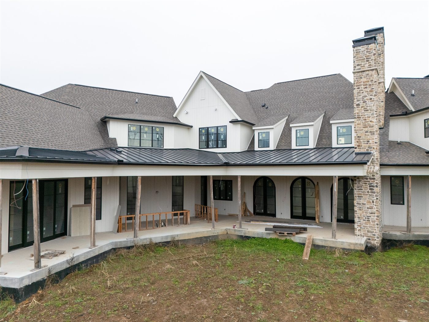 Rear covered porch with stone columns